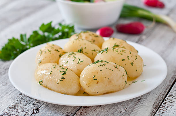 istock Young boiled potatoes with butter and dill 476896822