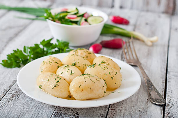 istock Young boiled potatoes with butter and dill 476896832