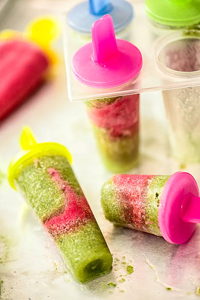 istock Homemade Green and Berry Popsicles 476897790