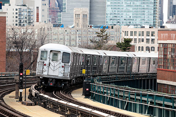 istock Subway Train Speeding on Elevated Track in Queens, New York 476897896