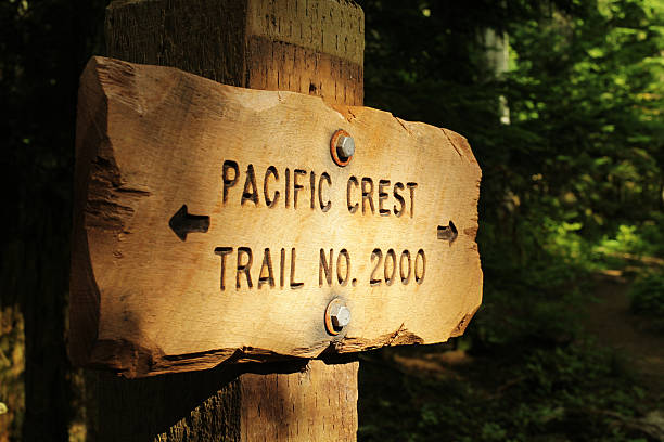 Pacific Crest Trail marker A marker along the popular Pacific Crest trail which follows the Cascades and Sierra mountain ranges and stretches from Canada to Mexico. This marker is near Mt. Hood in Oregon. pacific crest trail stock pictures, royalty-free photos & images