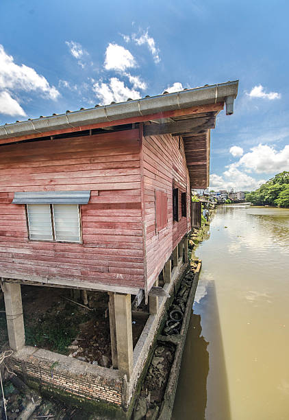Old wooden house along the river at chantaburi province,Thailand stock photo