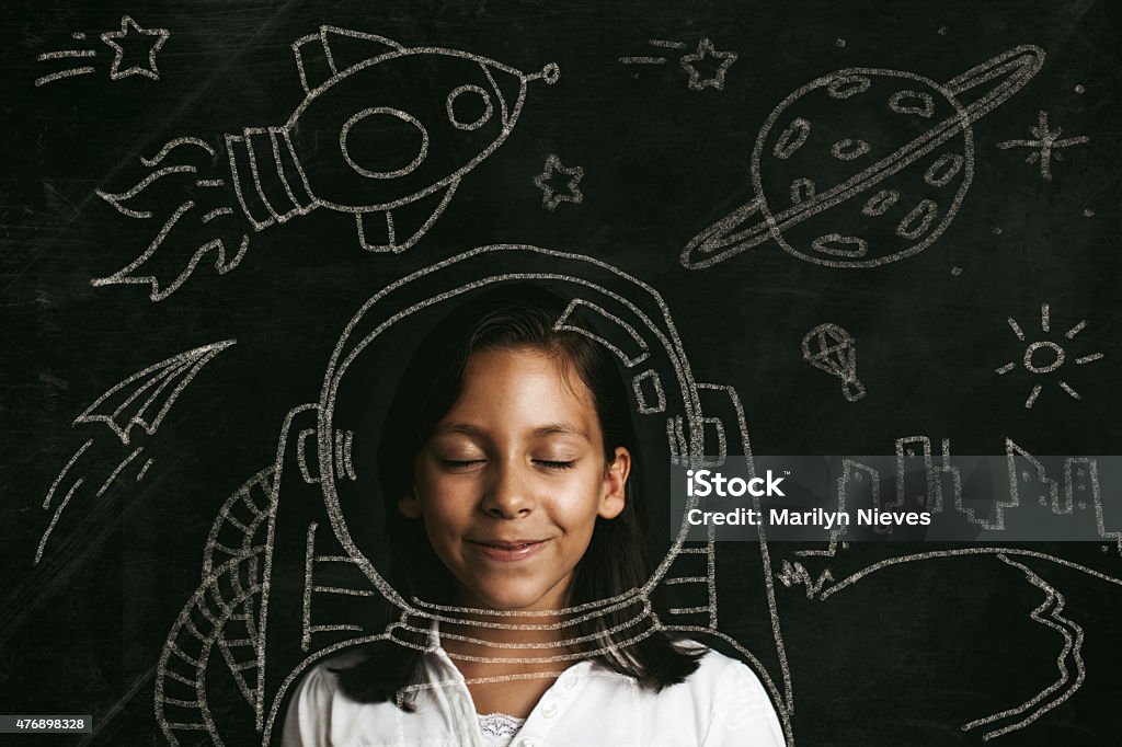 aspirations to be an astronaut Young girl dreaming of flying to space. Illustrative concept. Child Stock Photo