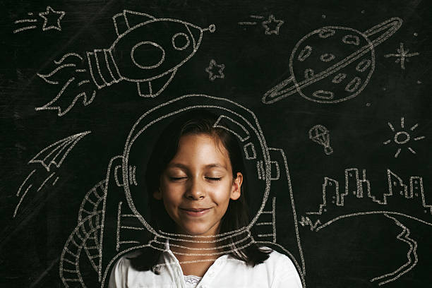 aspirations to be an astronaut Young girl dreaming of flying to space. Illustrative concept. 21st century photos stock pictures, royalty-free photos & images
