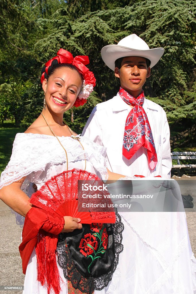 Mexican dance Veliko Tarnovo, Bulgaria- July 26, 2005: Beautiful mexican girl in Veliko Tarnovo, Bulgaria - July 24, 2005: Mexican dancers in traditional costume plays traditional dance on "International Folklore Festival Veliko Tarnovo". The festival  is a prestigious folklore event which became significant and traditional part of the cultural life of the ancient capital of Bulgaria. A real long – expected holiday for habitants and guests of the city in the hot summer days. Today, Veliko Tarnovo is the center of one of the largest urban areas in Bulgaria. 20-29 Years Stock Photo