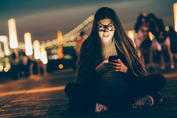 istock Young nerd woman texting on the phone 476899686