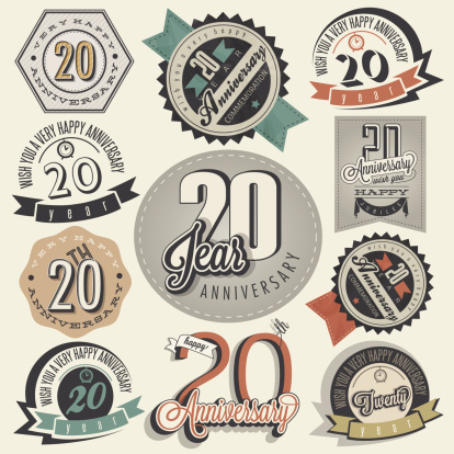Twenty anniversary design in retro style. Vintage labels for anniversary greeting. Hand lettering style typographic and calligraphic symbols for 20 anniversary.