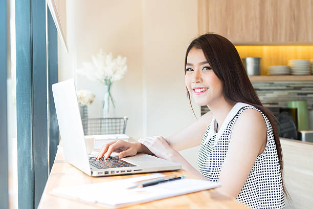 istock Beautiful business woman using a laptop computer 476902822
