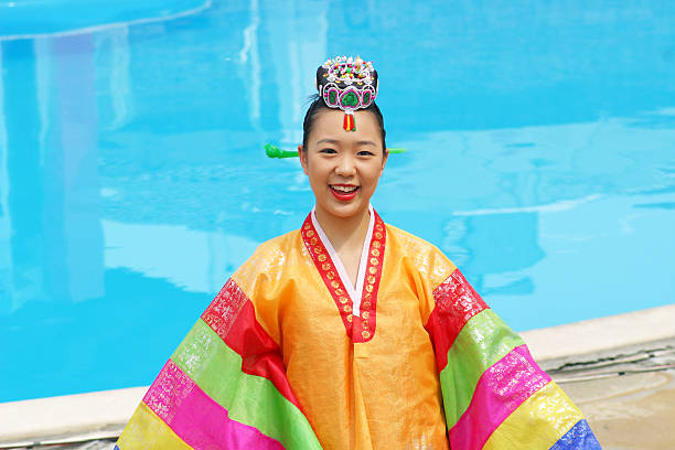 Veliko Tarnovo, Bulgaria - July 24, 2005: Beautiful asian girl in Veliko Tarnovo. Korean woman in traditional costume plays traditional dance on \