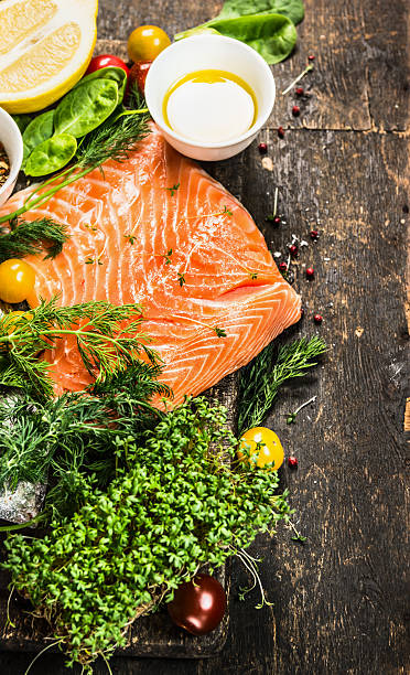 Salmon fillet with oil and  fresh ingredients for cooking