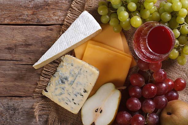 istock Molded cheese, wine and fruit horizontal top view closeup 476910516