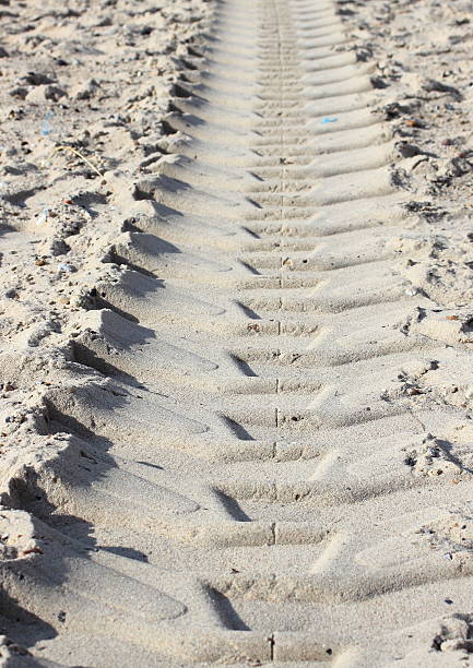istock Heavy tractor track in dry beach sand at summer 476910635