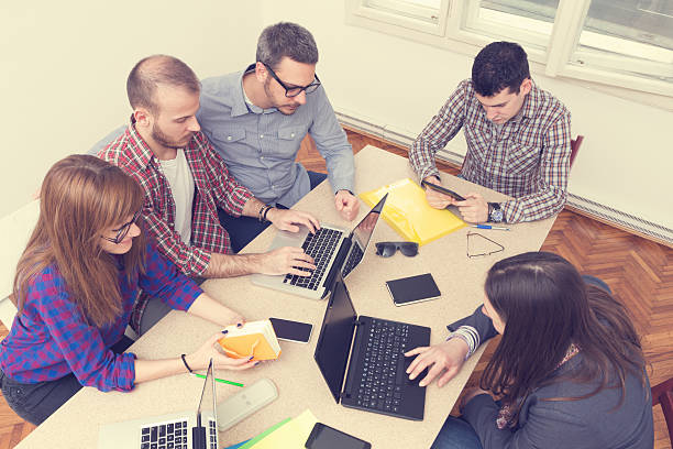 istock Young group of people discussing business plans 476915050