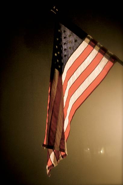 istock American Flag on a Foggy Night 476916409
