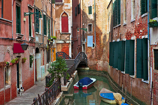 istock Typical venetian canal among old building. 476916999