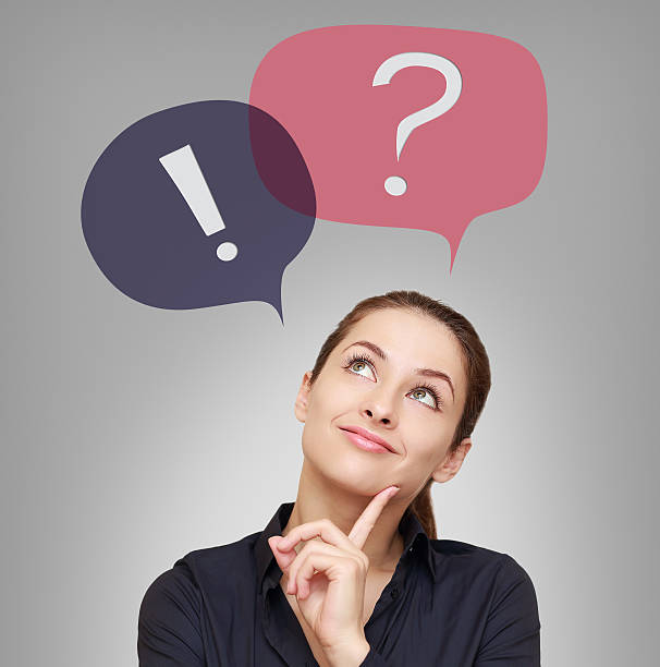 istock Thinking woman looking on question and exclamation above 476917653
