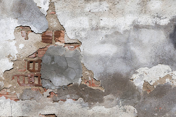 istock Damaged plaster of a brick wall 476925382