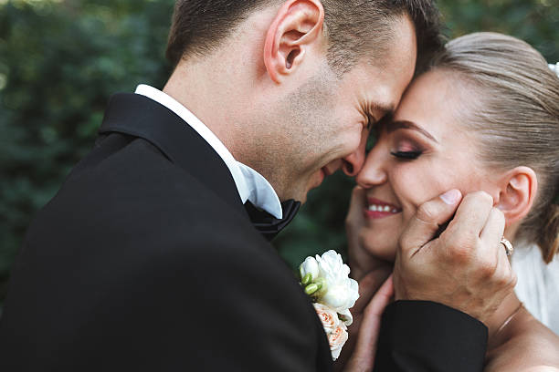 istock the bride and groom posing together at camera 476931362