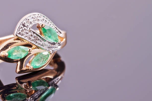 istock Gold earrings with green emeralds 476931760