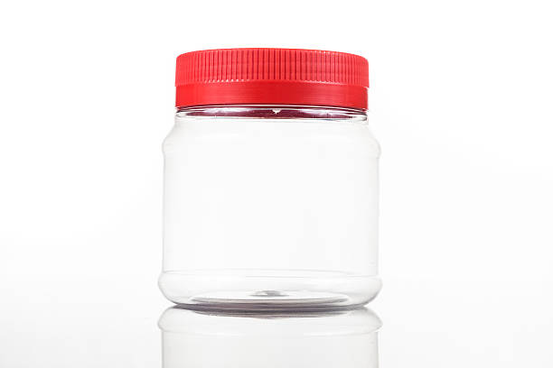 istock Translucent plastic PVC jar with red cover isolated in white 476935382