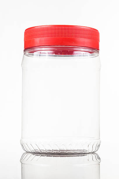 istock Translucent plastic PVC jar with red cover isolated in white 476935386