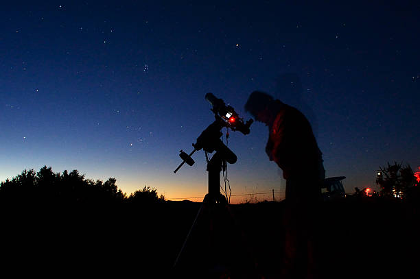 Astronomer in the night Astronomer in the night under a starry sky astronomer photos stock pictures, royalty-free photos & images