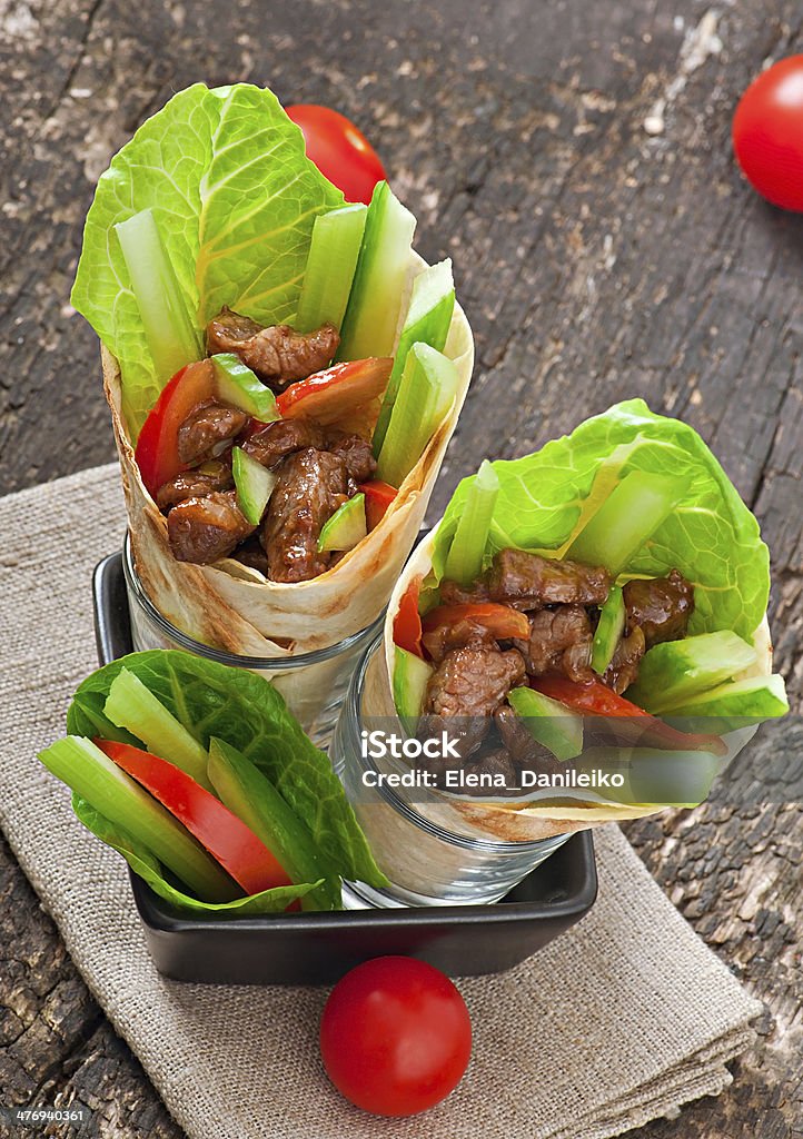 Tortilla wraps with meat and fresh vegetables Appetizer Stock Photo