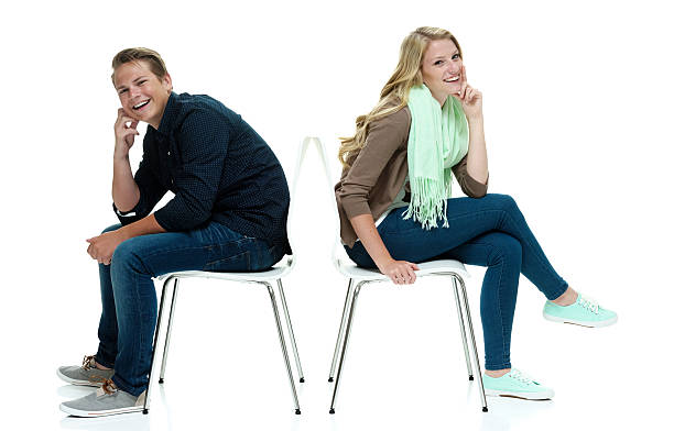istock Smiling couple sitting on chair 476945746