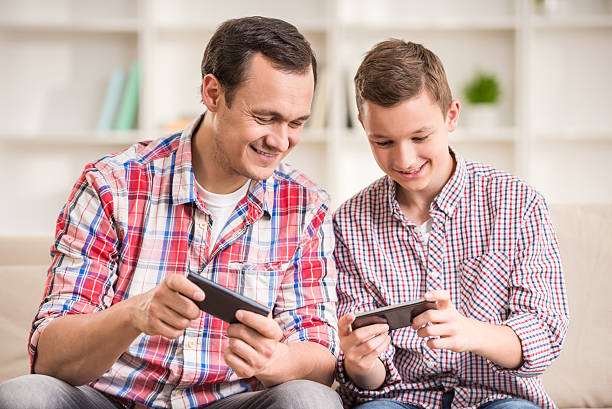 istock Father and son at home 476950366
