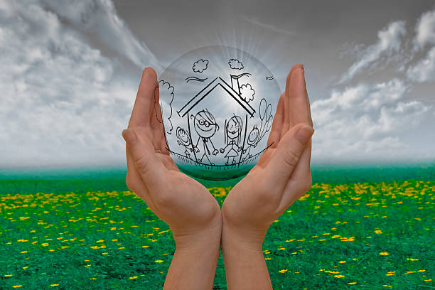 istock Hand Holding Bubble with Happy Family Concept 476951069