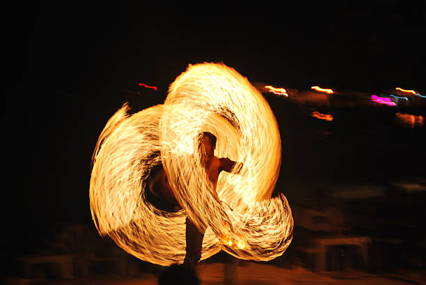 Fire Dance - Firestarter performing amazing fire show Koh Phi Phi, Thailand - December 15, 2012: Firestarter performing amazing fire show with sparkles in the night - Full moon party entertainment in Thailand nightlife at the beach phuket beach party stock pictures, royalty-free photos & images