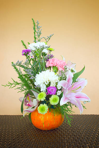 istock Beautiful autumn composition in pumpkin with decorative box on t 476955831