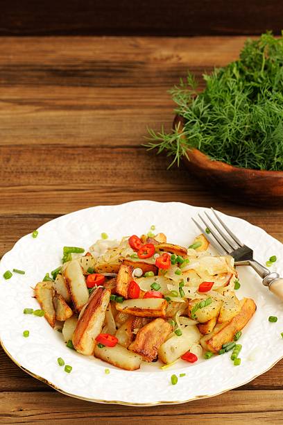 istock Fried potatoes with scallion and chili in white plate 476958110
