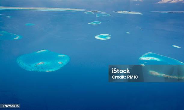 Aerial View Of Uninhabited Islands And Coral Reefs In Maldives Stock Photo - Download Image Now