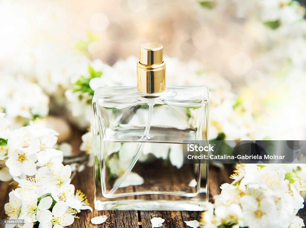 Flower Perfume Bottle Flower Perfume in Transparent Bottle with Spring Blossom Flower Stock Photo