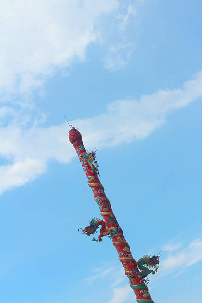 istock Twin Dragon on red pole on blue background. 476962040