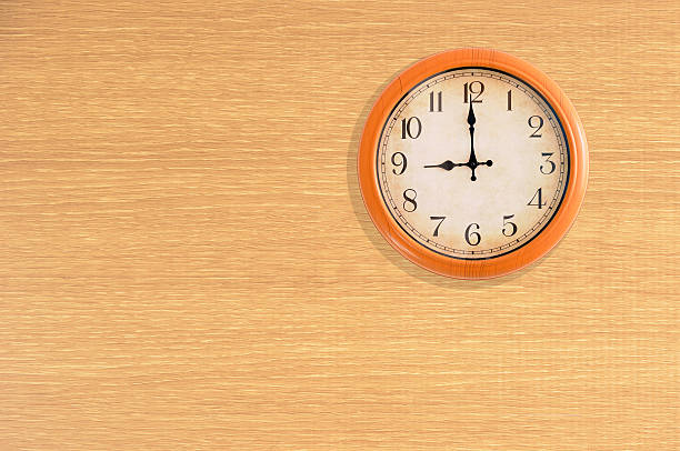 istock Clock showing 9 o'clock on a wooden wall 476962892