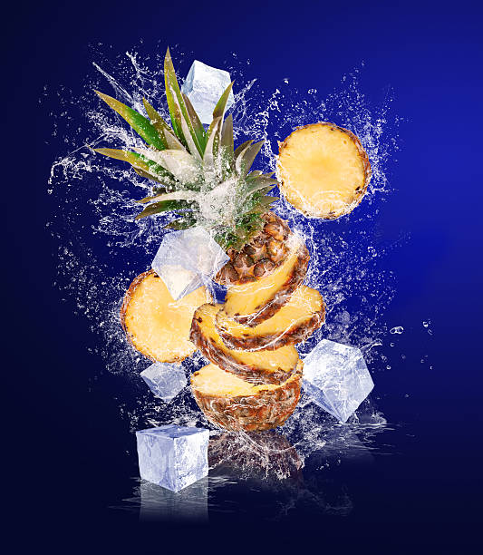 istock Sliced Pineapple in water splashes with ice cubes 476962923