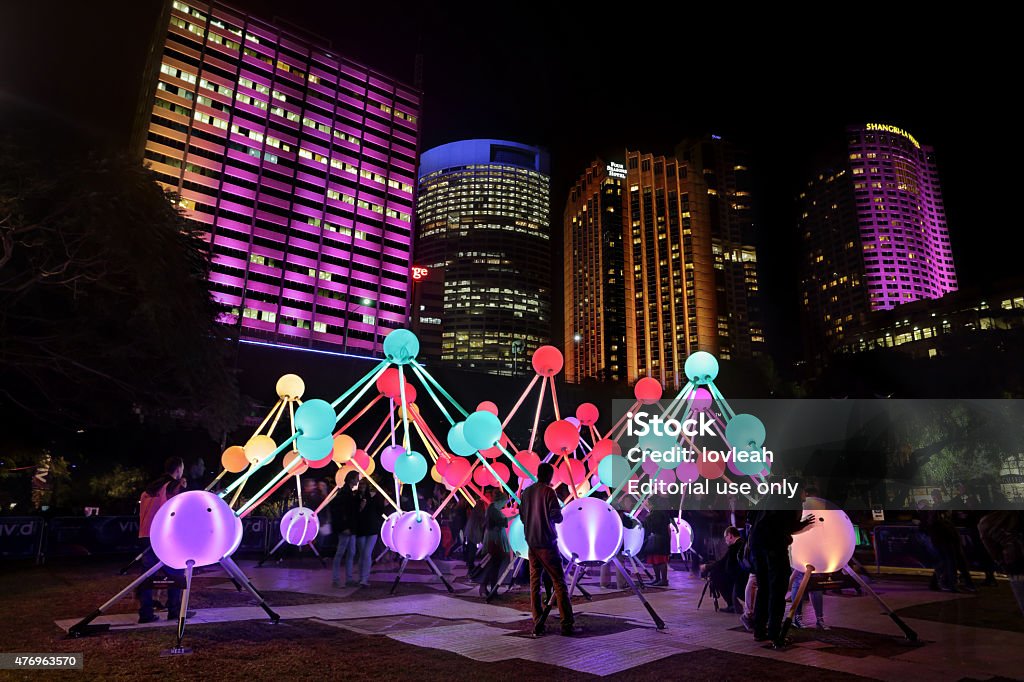 Affinity at Vivid Sydney Sydney, Australia  - May 27, 2015:  Tourists and local public enjoy the Affinity installation at Vivid Sydney, which  depict the  human brain and neurons.  When touched, the orbs set-up a striking display of sound and light.  People in motion.  Artists:  amigo & amigo (Simone Chua & Renzo B. Larriviere ) + S1T2 (Chris Panzetta & Naimul Khaled) Four Seasons Hotel Stock Photo