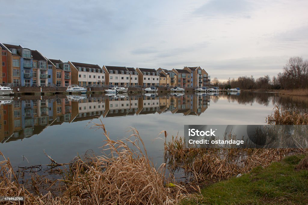 Modern houses by lake Modern houses by a lake, in St. Neots Cambridgeshire River Great Ouse Stock Photo