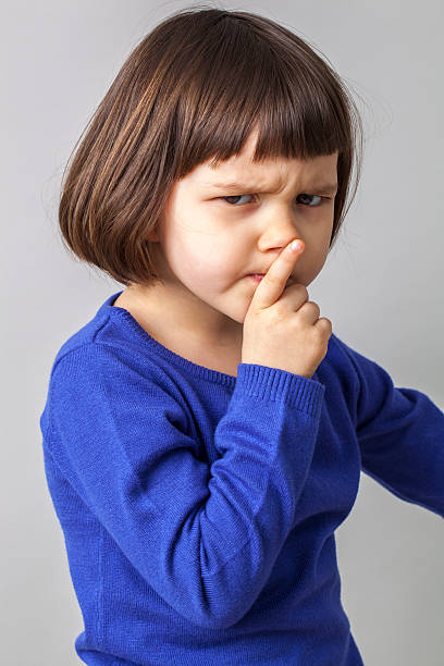istock toddler imitating a teacher with finger on lips for silence 476968152