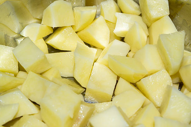 istock Cut raw potatoes in a saucepan 476968986