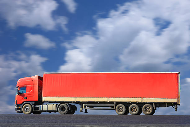 istock red truck goes on the way 476969610