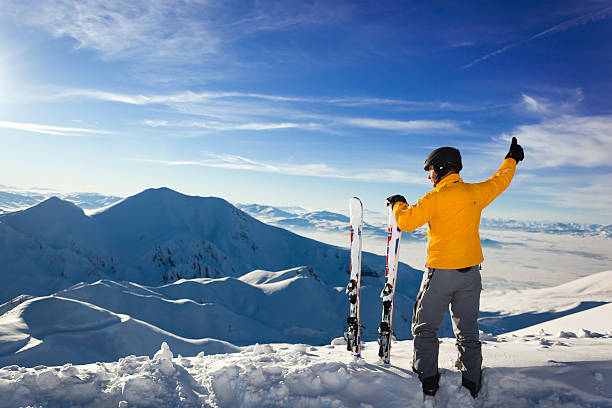 istock skier man on the peak of mountain 476971496