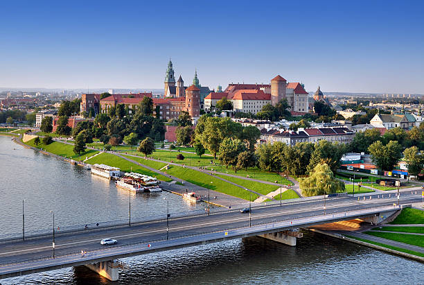 Cracow skyline with Vistula river, Wawel castle and bridge, Poland Cracow panorama with Wawel castle, Vistula river and Grunwaldzki bridge. Aerial view at sunset. wawel cathedral stock pictures, royalty-free photos & images