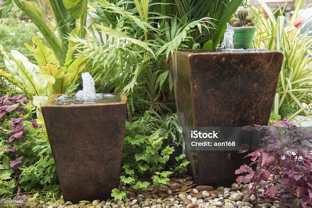 fountain from pot water feature in garden is Chinese belief   fountain from pot  put on right front of house is lucky Fountain Stock Photo