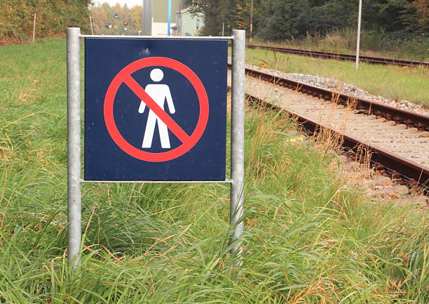 istock Sign prohibits access to a railway area 476975193