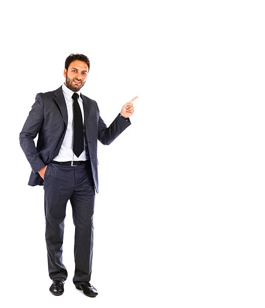 istock Young businessman pointing on blank background 476975603