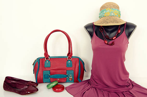 istock Purple dress on mannequin with matching accessories. 476975732