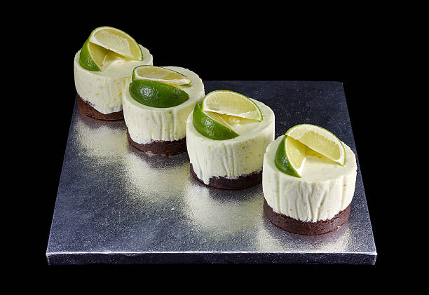 istock Four small cakes decorated with lime wedges 476976938